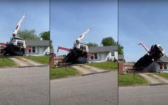 Un camion grue se retourne en tentant d’arracher un arbre [video]